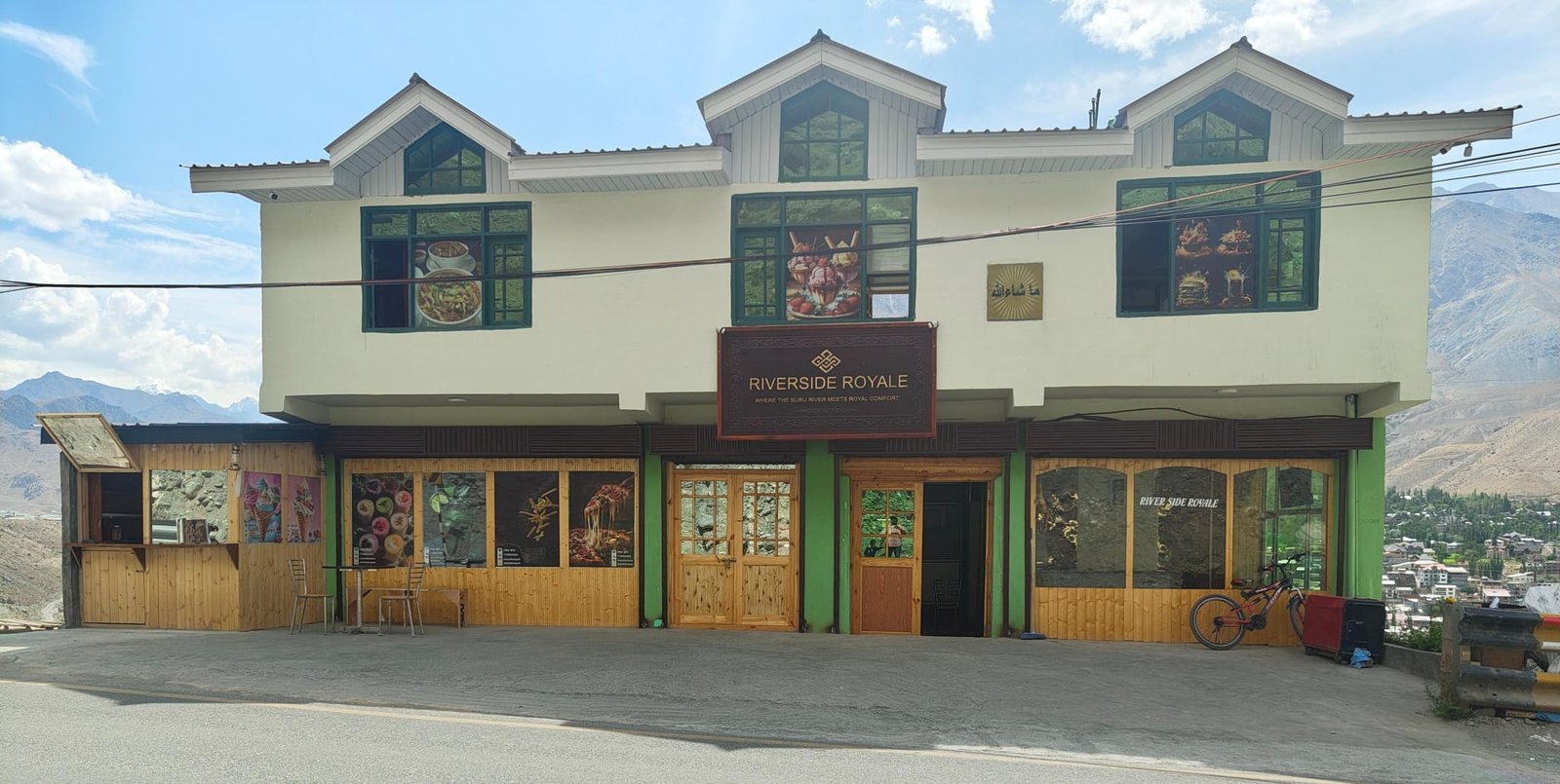 Riverside Royale hotel exterior at night